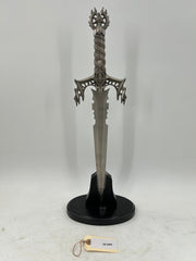 Gothic Fantasy Dagger – Ornate Metal Hilt with Serrated Blade and Wooden Display Stand