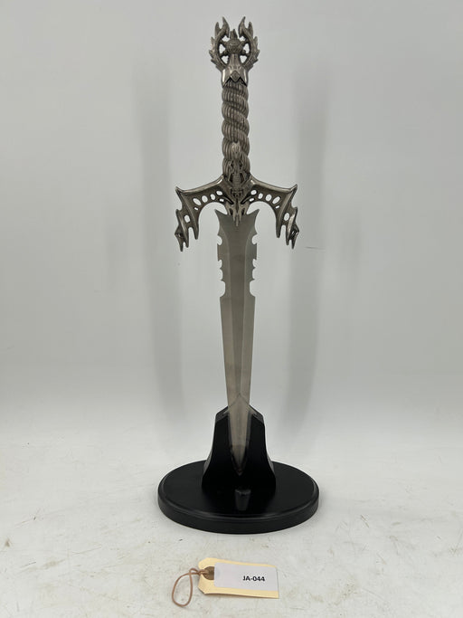 Gothic Fantasy Dagger – Ornate Metal Hilt with Serrated Blade and Wooden Display Stand